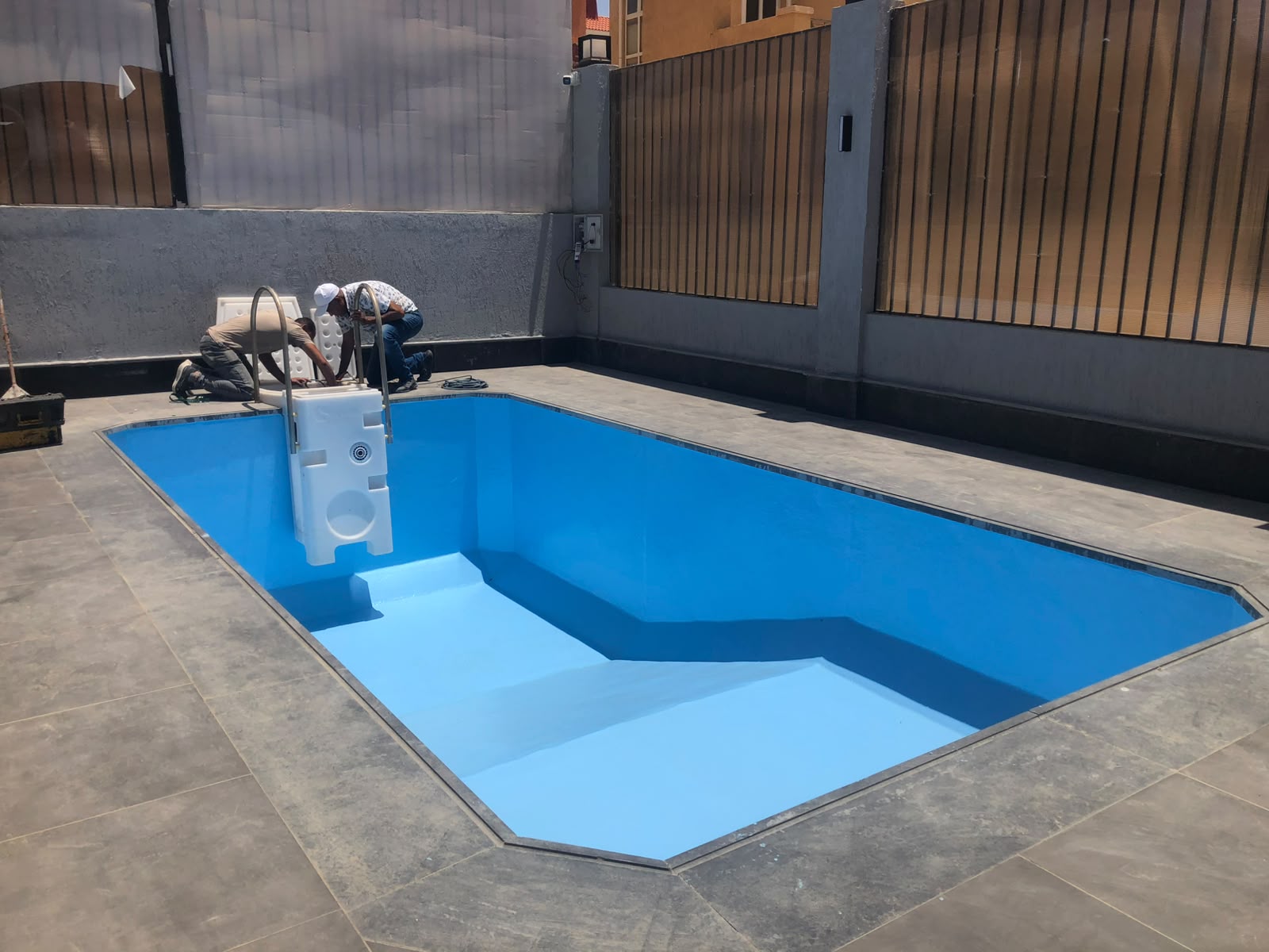 Rectangular pool installation in progress